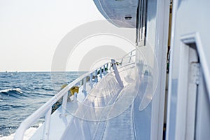 The white yacht deck during sailing on a sea