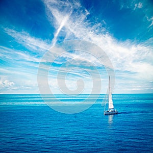 White Yacht Sailing in Blue Sea