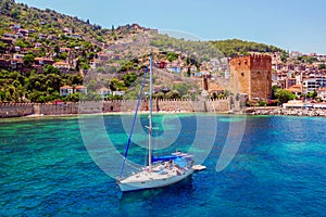 White yacht in the sea bay. Harbor of the Red Tower Alanya, Turkey