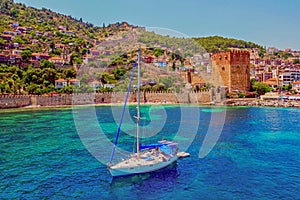 White yacht in the sea bay. Harbor of the Red Tower Alanya, Turkey