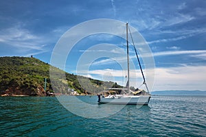 White Yacht in the sea near the island. photo