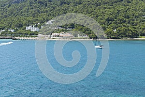 White yacht with turquoise sea in Antalya