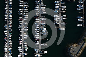 White yachts at the berths in the seaport, aerial view