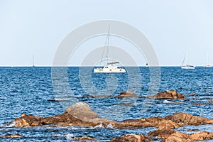 White yachts in blue ocean