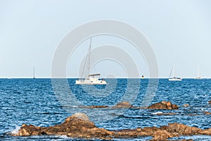 White yachts in blue ocean