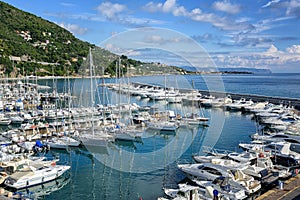 White yachts docked in port of Alassio on Riviera, Italy