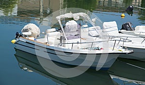 White yachts in the port are waiting. The sea is calm.