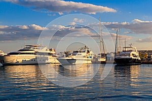 White yachts in the sea harbor of Hurghada, Egypt. Port with tourist boats on the Red Sea