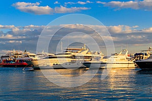 White yachts in sea harbor of Hurghada, Egypt. Port with tourist boats on the Red Sea