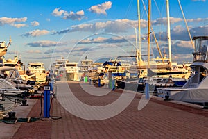 White yachts in sea harbor of Hurghada, Egypt. Port with tourist boats on the Red Sea