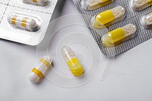 White and yellow capsules