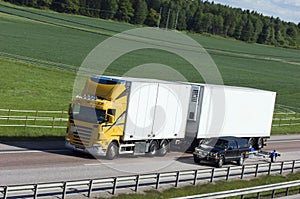 White and yellow lorry in the countryside