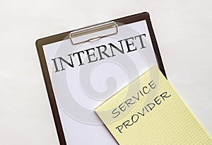 White and yellow paper with text Internet Service Provider on a white background with stationery