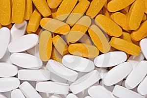 White and yellow pills background