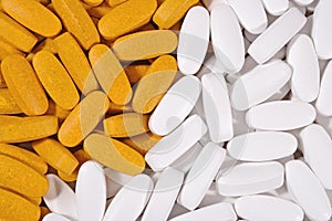 White and yellow pills background