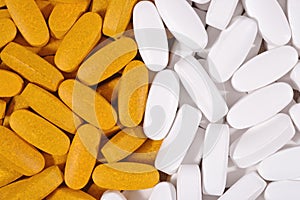 White and yellow pills background