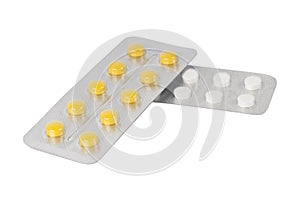 White and yellow pils tablets in blister pack