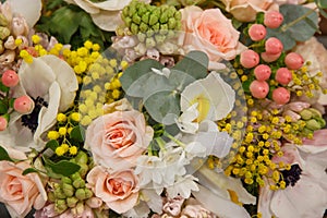 White yellow pink bouquet with different flowers closeup. Flowers background