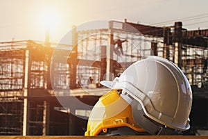 white and yellow safety helmet in construction site