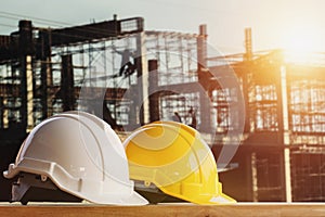 white and yellow safety helmet in construction site