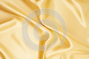 The White yellow satin texture that is white silver fabric silk background with beautiful soft blur pattern natural