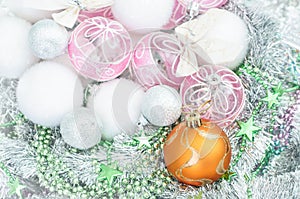 White and yellow xmas ornaments and Christmas balls on glitter h