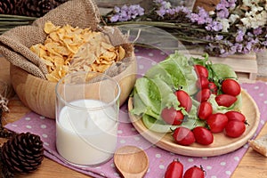 White yogurt and fresh cherry tomatoes with cornflake.