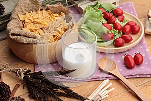 White yogurt and fresh cherry tomatoes with cornflake.