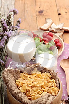 White yogurt and fresh cherry tomatoes with cornflake.