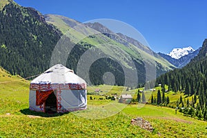 White Yurt in the mountains of Kyrgyzstan. photo
