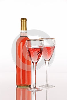 White zinfandel wine bottle with two glasses photo