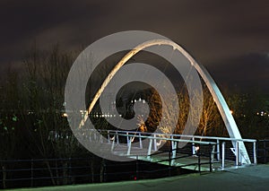 whitehall bridge a pedestrian footbridge crossing the river aire in leeds illuminated at night