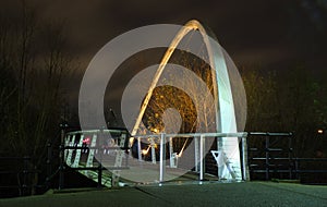 whitehall bridge a pedestrian footbridge crossing the river aire in leeds illuminated at night