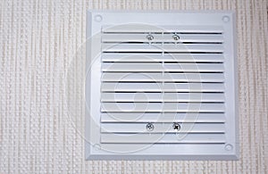 whiter air circular vent window in bathroom, wall ventilation grate