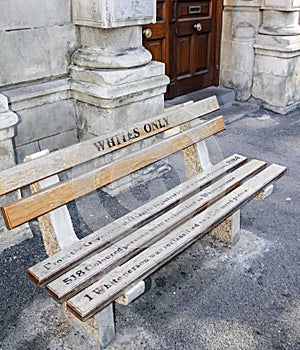 Whites only -  old bench with an inscription left as  memory of apartheid, racism and segregation
