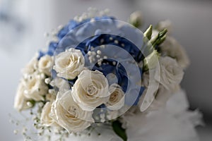 whites roses and blue orthensia wedding bouquet close-up photo