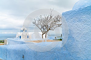 Whitewashed buildings and Bell Tower in Oia, Santorini