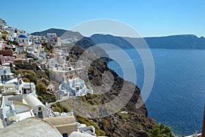 Whitewashed buildings with blue domes characterizing Santorini, Greece,