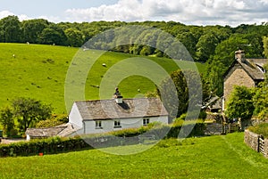 Whitewashed cottage in rural setting.