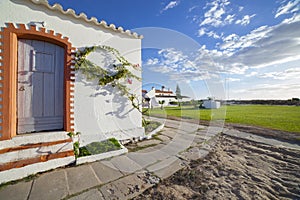 Whitewashed fishermen huts, converted into tourist facilities, Tavira, Portugal