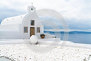 Whitewashed Greek orthodox church in Oia, Santorini