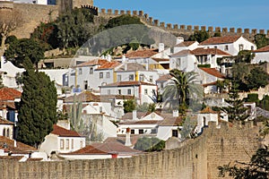 Whitewashed houses within the walled citadel. Obidos. Portugal