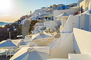 Whitewashed luxury hotels on Caldera cliff top Santorini Greece