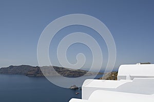 Whitewashed rooftops above sea at Oia, Santorini, Greece.