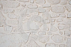 Whitewashed stone wall background texture