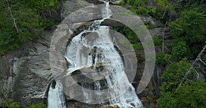 Whitewater Falls in Nantahala National Forest, North Carolina, USA. Clear water falling down from rocky boulders between