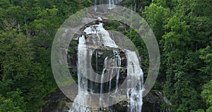 Whitewater Falls in Nantahala National Forest, North Carolina, USA. Clear water falling down from rocky boulders between