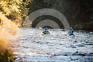 Whitewater kayaker paddling on river