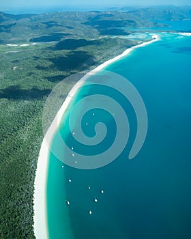 Whitsunday coastline aerial with boats and hills scenery