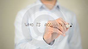Who is Accountable, Man Writing on Transparent Screen photo